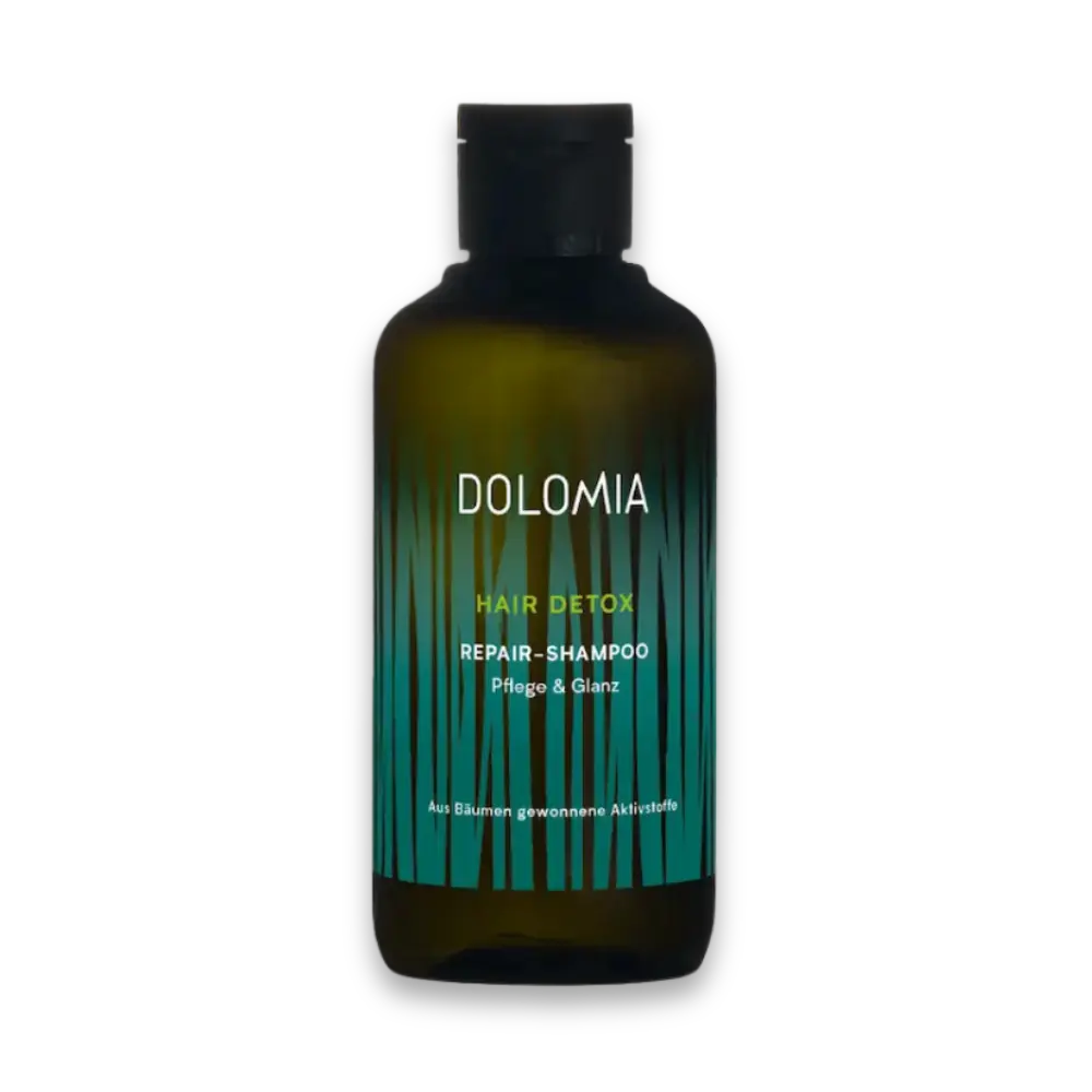 Dolomia Hair Detox Repair-Shampoo für Pflege und Glanz in grüner Flasche mit dekorativem Grasmuster, Vorderansicht