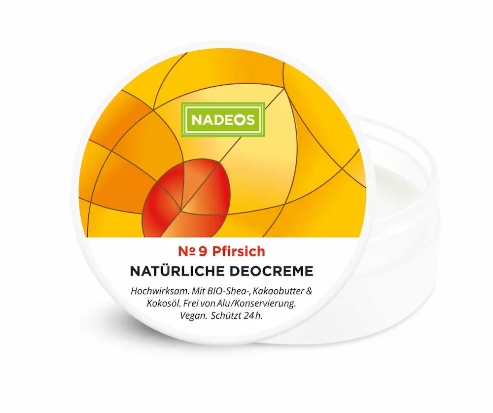 Geöffneter Tiegel NADEOS Natürliche Deocreme № 9 Pfirsich mit gelb-orangem Deckel, Pfirsich-Motiv und sichtbarer weißer Creme