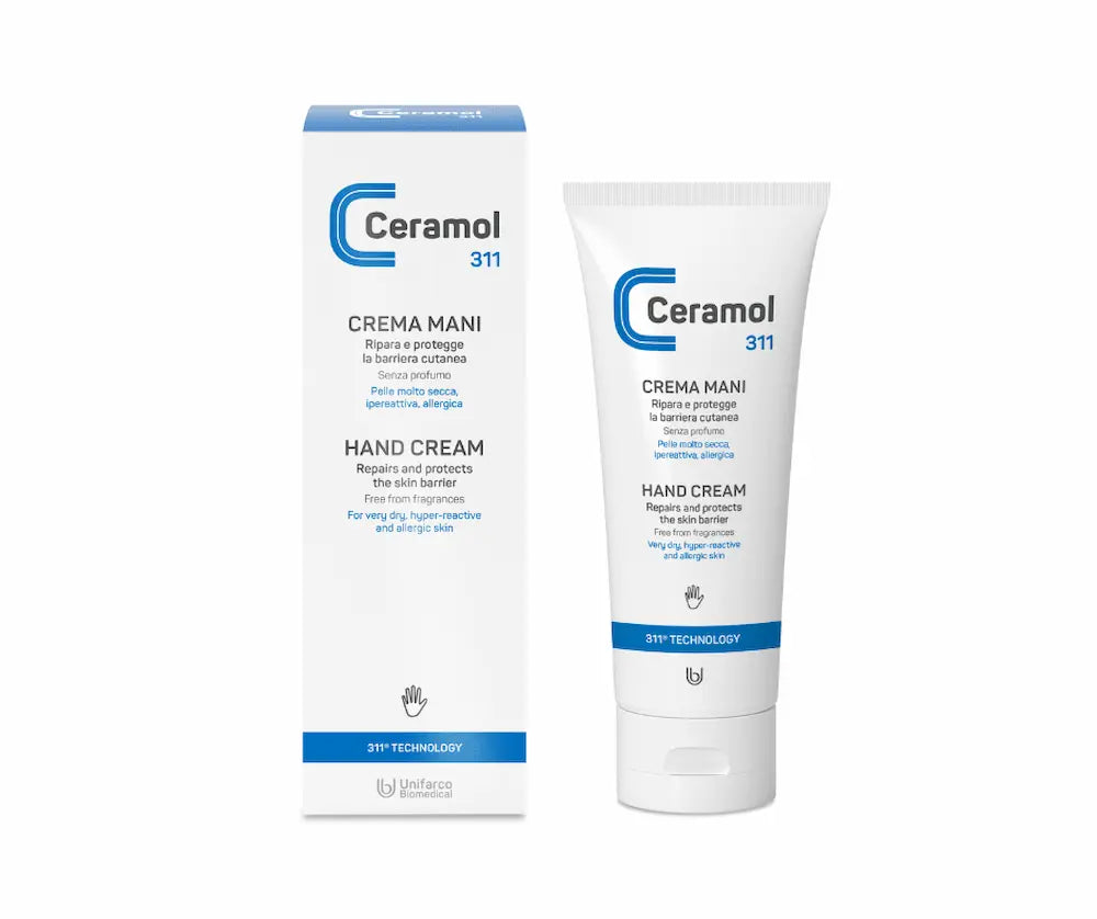 Ceramol 311 Handcreme als weiße Tube neben weißer Faltschachtel mit blauem Logo, Aufschrift „Crema Mani / Hand Cream"