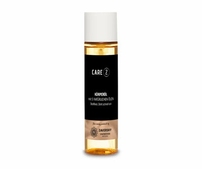 CARE Z Körperöl mit 5 natürlichen Ölen, transparente Flasche mit goldenem Öl, schwarzem Etikett und weißem Verschluss