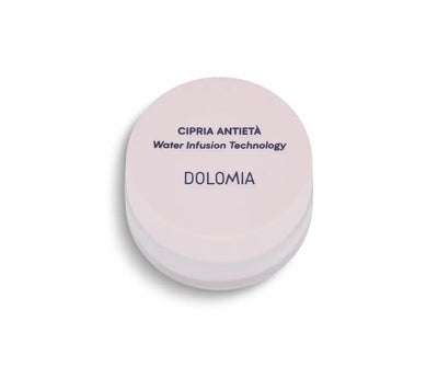 Runde rosafarbene Puderdose Dolomia Cipria Antietà mit Water Infusion Technology, geschlossen in Draufsicht.