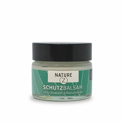 Nature Z Schutzbalsam im Glastiegel mit schwarzem Deckel, grünem Etikett und Aufschrift „mit Bio Sheabutter & Rosmarinextrakt“.