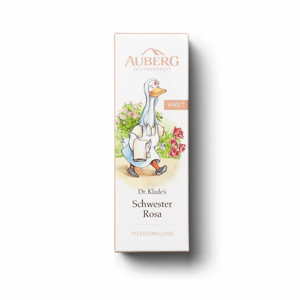Verpackung von Auberg Dr. Klade's Schwester Rosa Pflegeemulsion mit Gänse-Illustration in Krankenschwester-Kleidung und Blumenmotiv, Kategorie Haut.