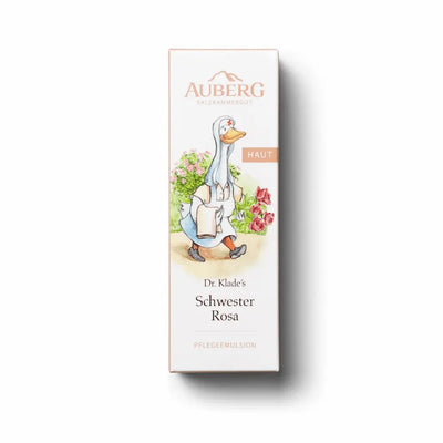 Verpackung von Auberg Dr. Klade's Schwester Rosa Pflegeemulsion mit Gänse-Illustration in Krankenschwester-Kleidung und Blumenmotiv, Kategorie Haut.